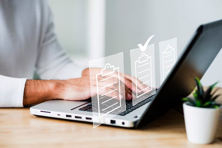 Hands typing on a laptop with virtual checklists floating above. Wooden desk, potted plant, and a calm, focused atmosphere.
