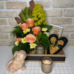 Flower Sympathy Box with yellow and orange blooms, greenery and natural accents, a handmade heart, a candle and a condolence card