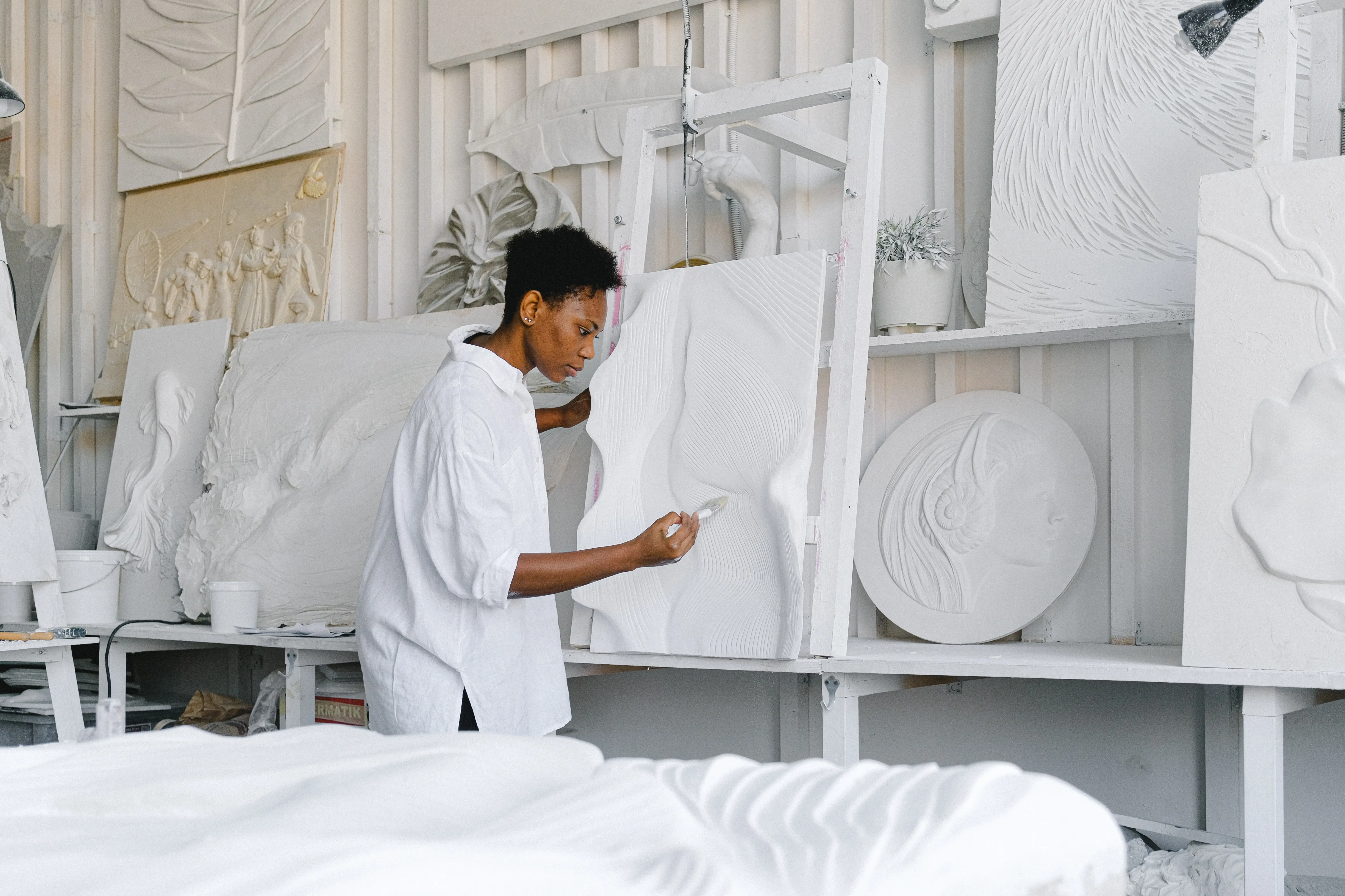 Artist Sculpter at Work Creating Art for Online Portfolio