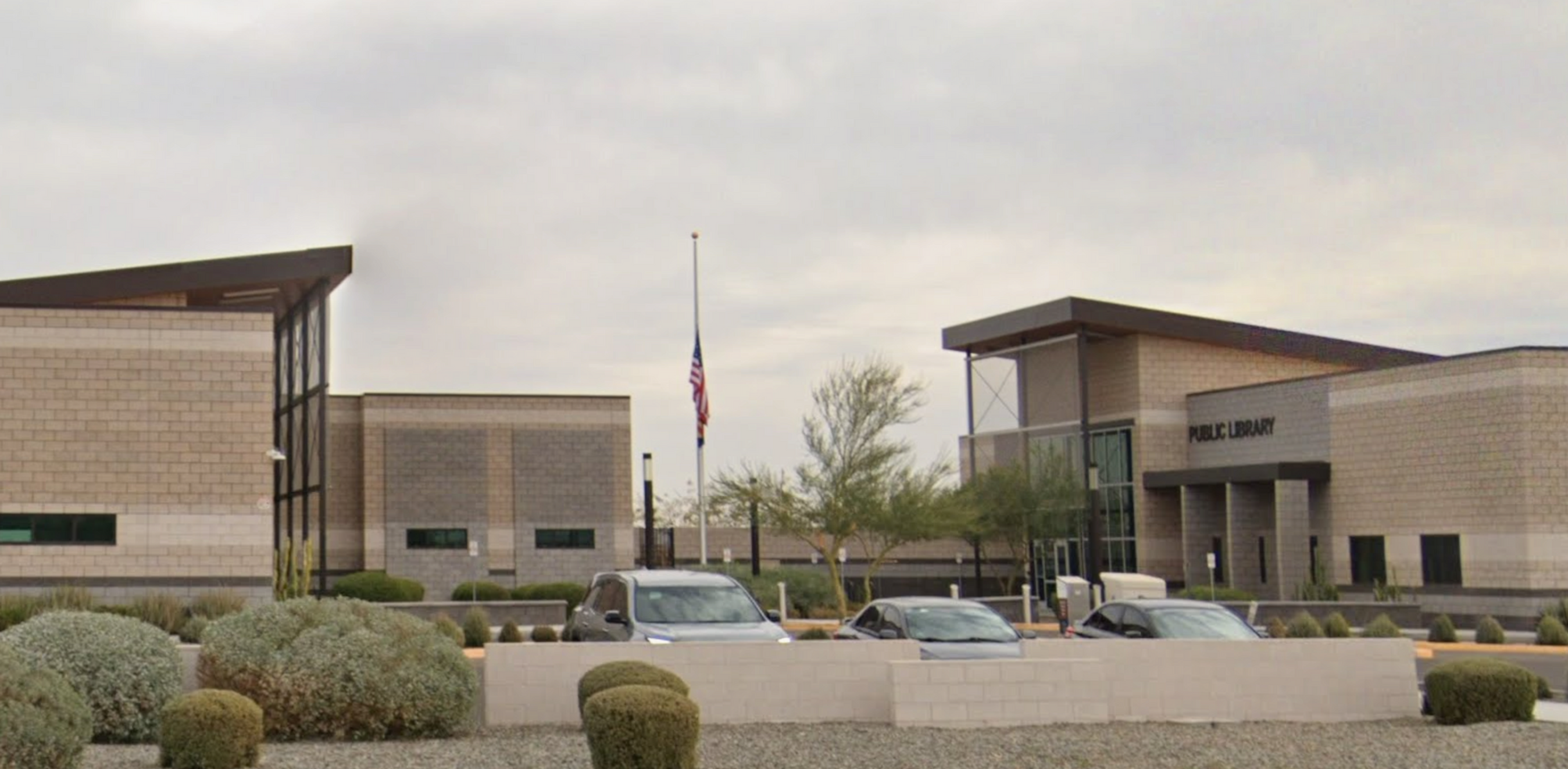 Eye-level view of San Tan Valley town hall building with American Flag.