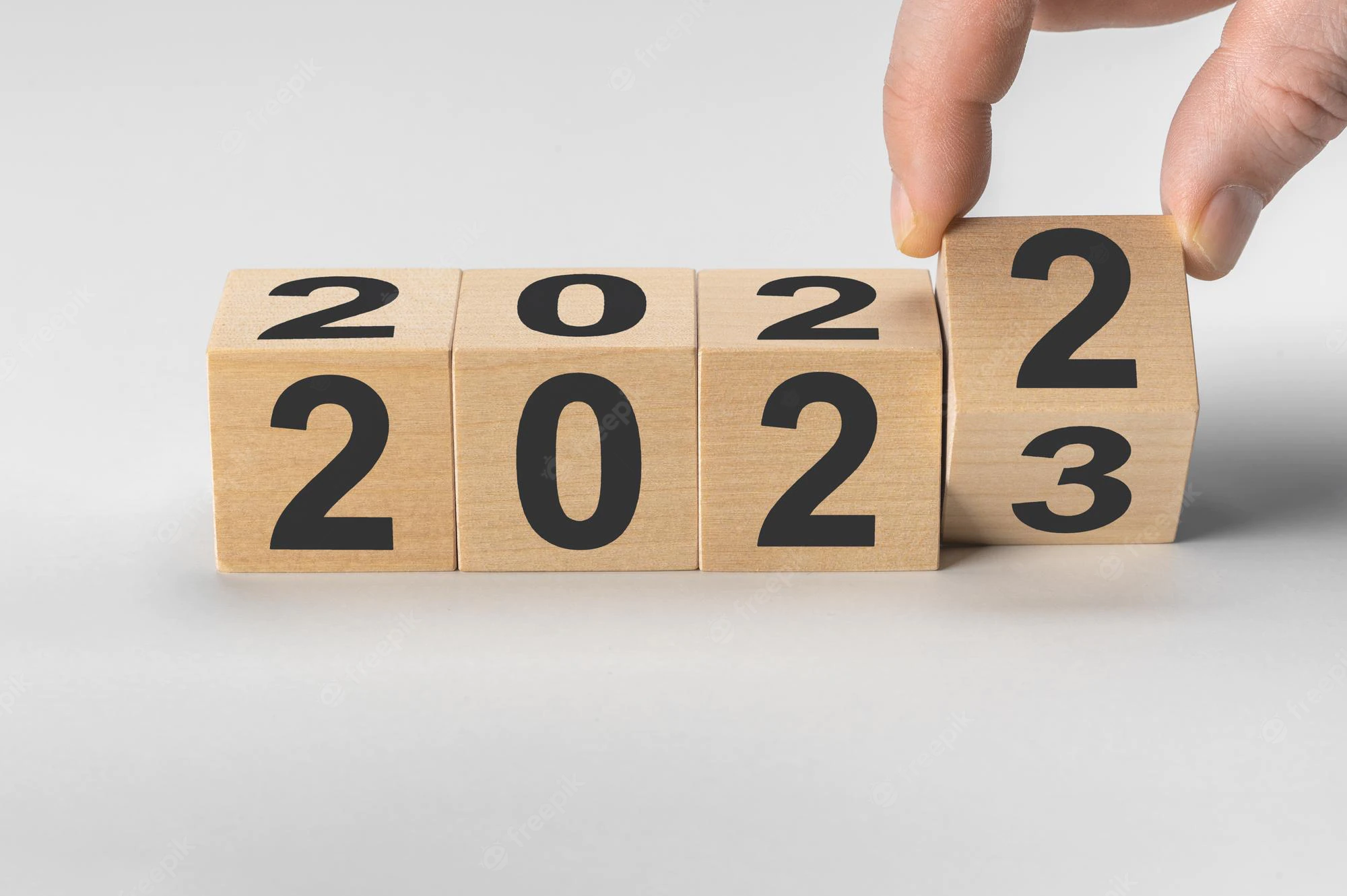 happy-new-year-concept-flipping-wooden-cube-block-change-from-2022-2023-wooden-cube-with-f
