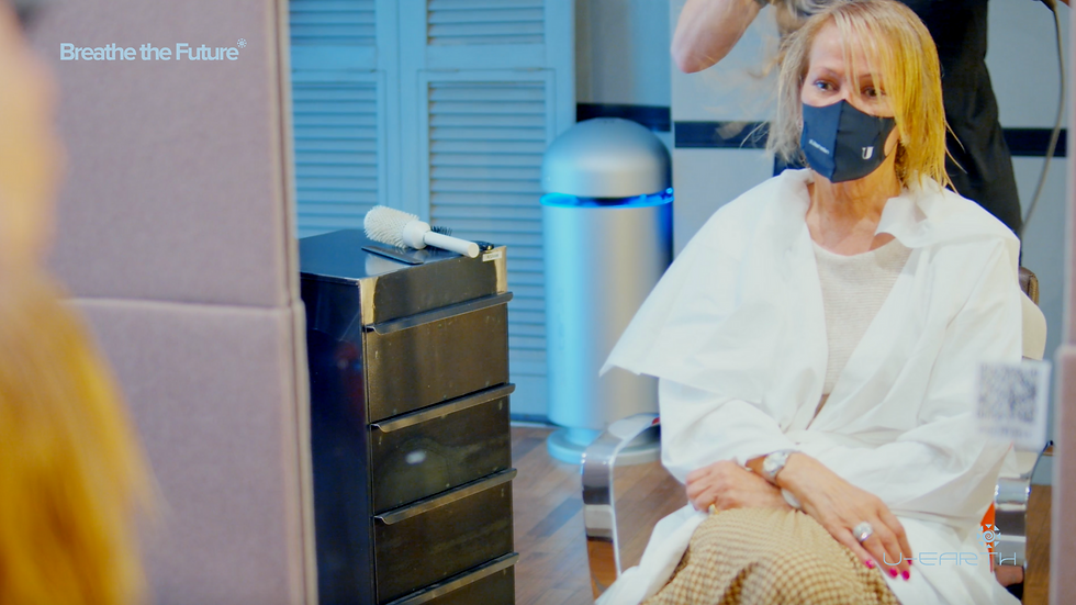 A lady has her hair done at a Pure Air Zone - Rubertelli hair salon