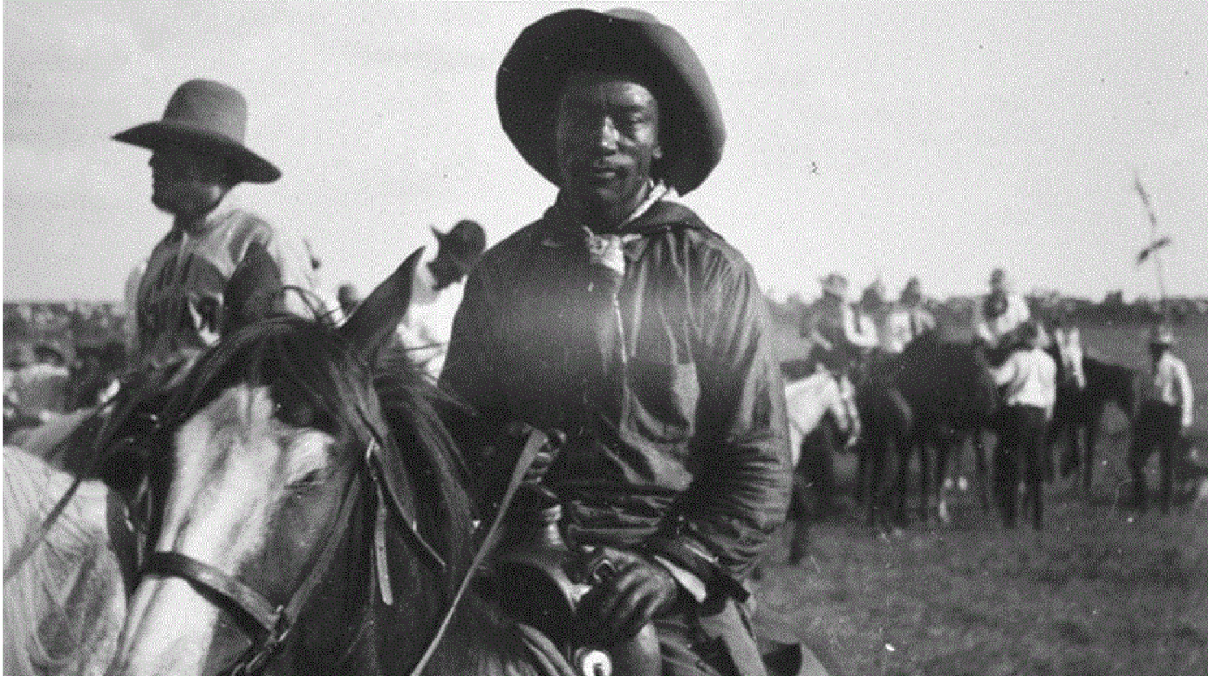 Man sitting on a horse, old photo