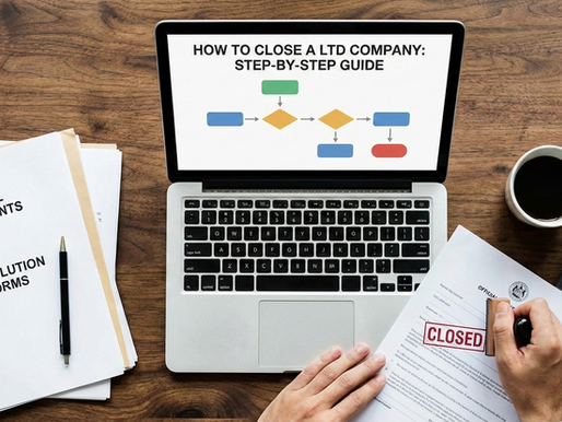 person sat at a laptop with paperwork to close a company