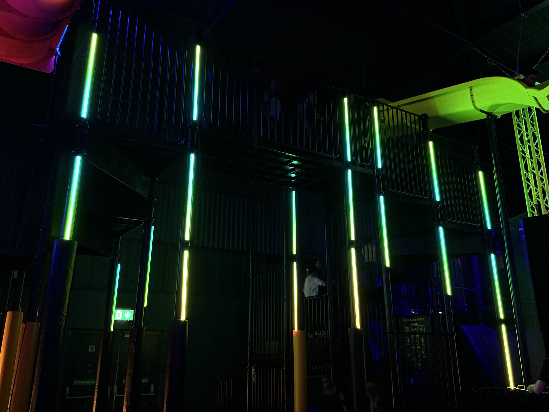 Vertical strips of lighting installed under slide
