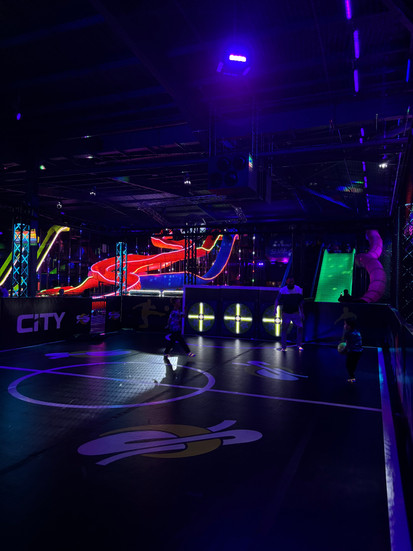 Interactive football pitch with slides in background