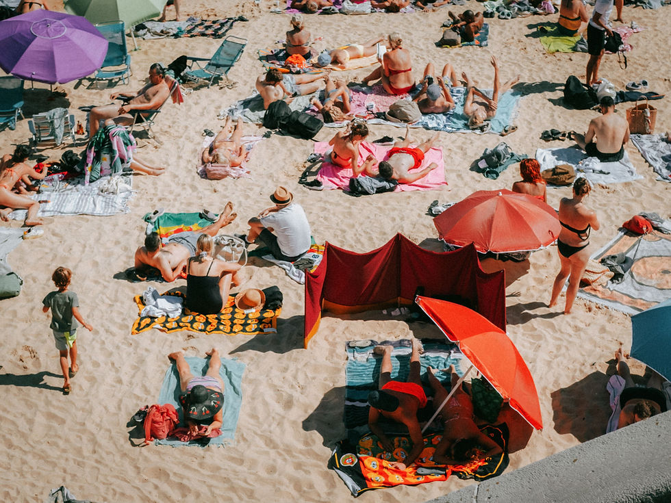 People relaxing on a sandy beach