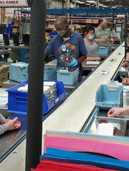 individuals with disabilities working at an assembly line