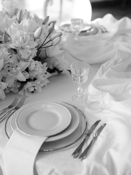 Table setting with white florals and glassware, styled shoot