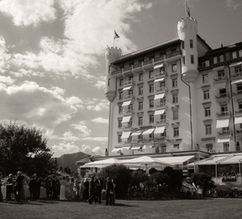 Guests gathered on the terrace below the hotel facade