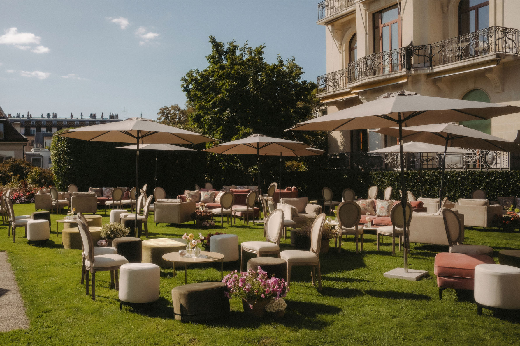 Garden terrace set with lounge seating above the lake