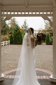 Bride stands in the Veiled Garden gazebo. Vintage wedding Portland