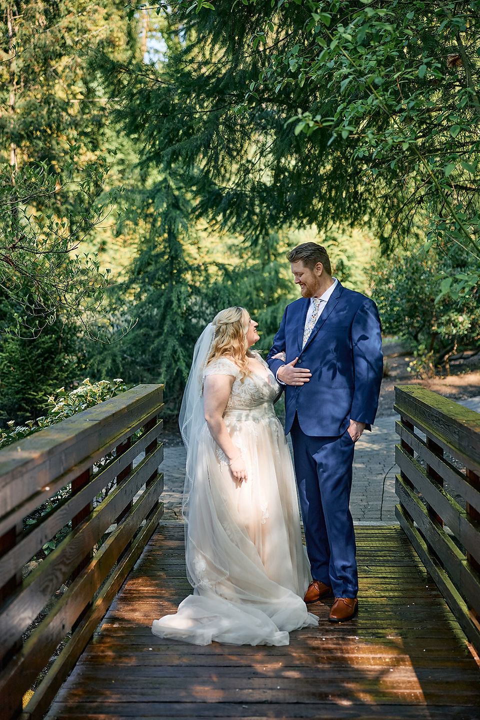 Bride and groom first look in the Veiled Garden bridge at Abernethy Center