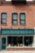 Standalone Urban storefront in a mill town, brick, stone, generic, ultra realistic.jpg
