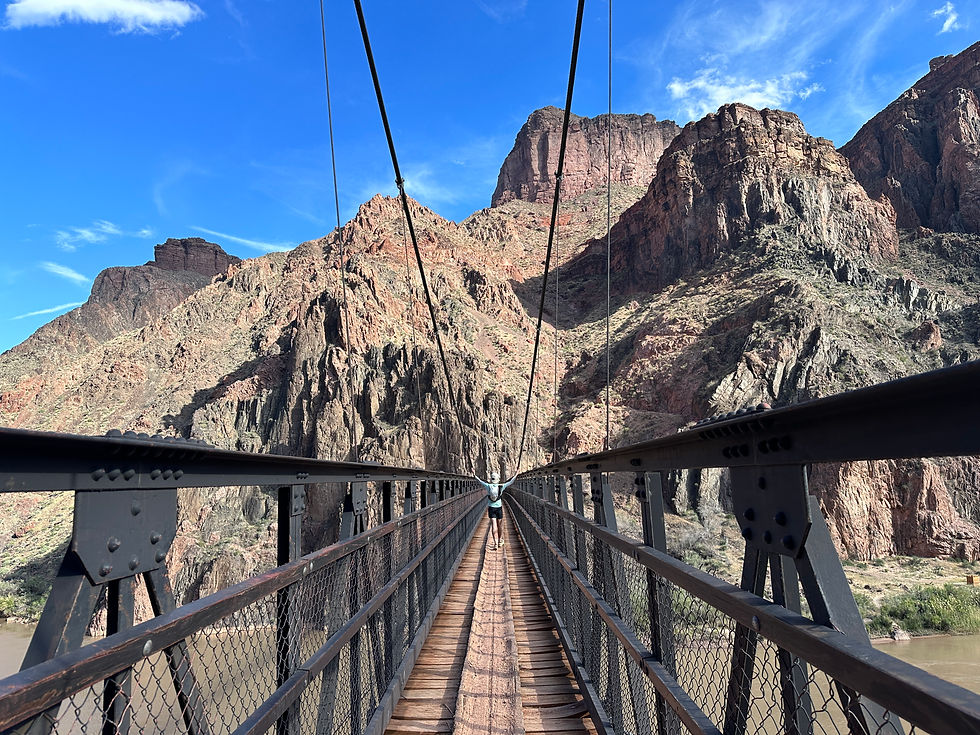 Trail runner crossing Black Bridge in the Grand Canyon
