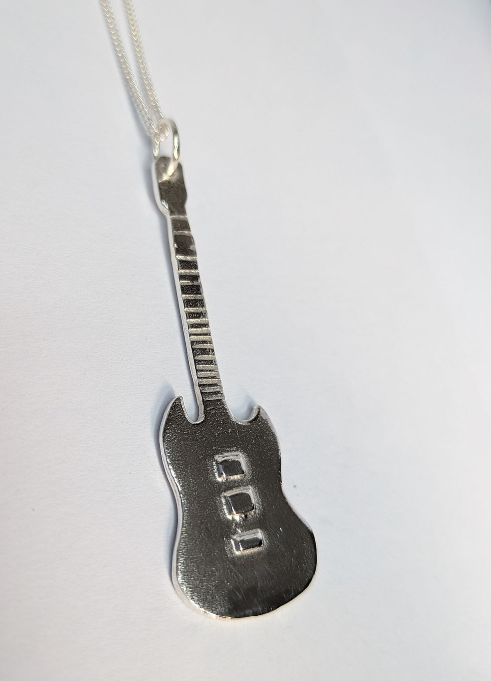 Thumbnail: Silver Guitar  pendant. Thunderbird, Flying V or SG.