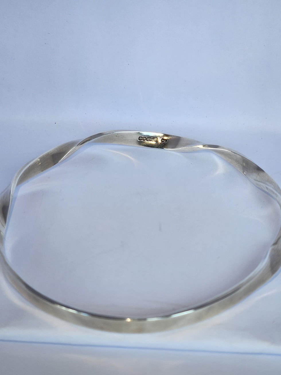Thumbnail: Smooth Twist Bangle in Sterling Silver