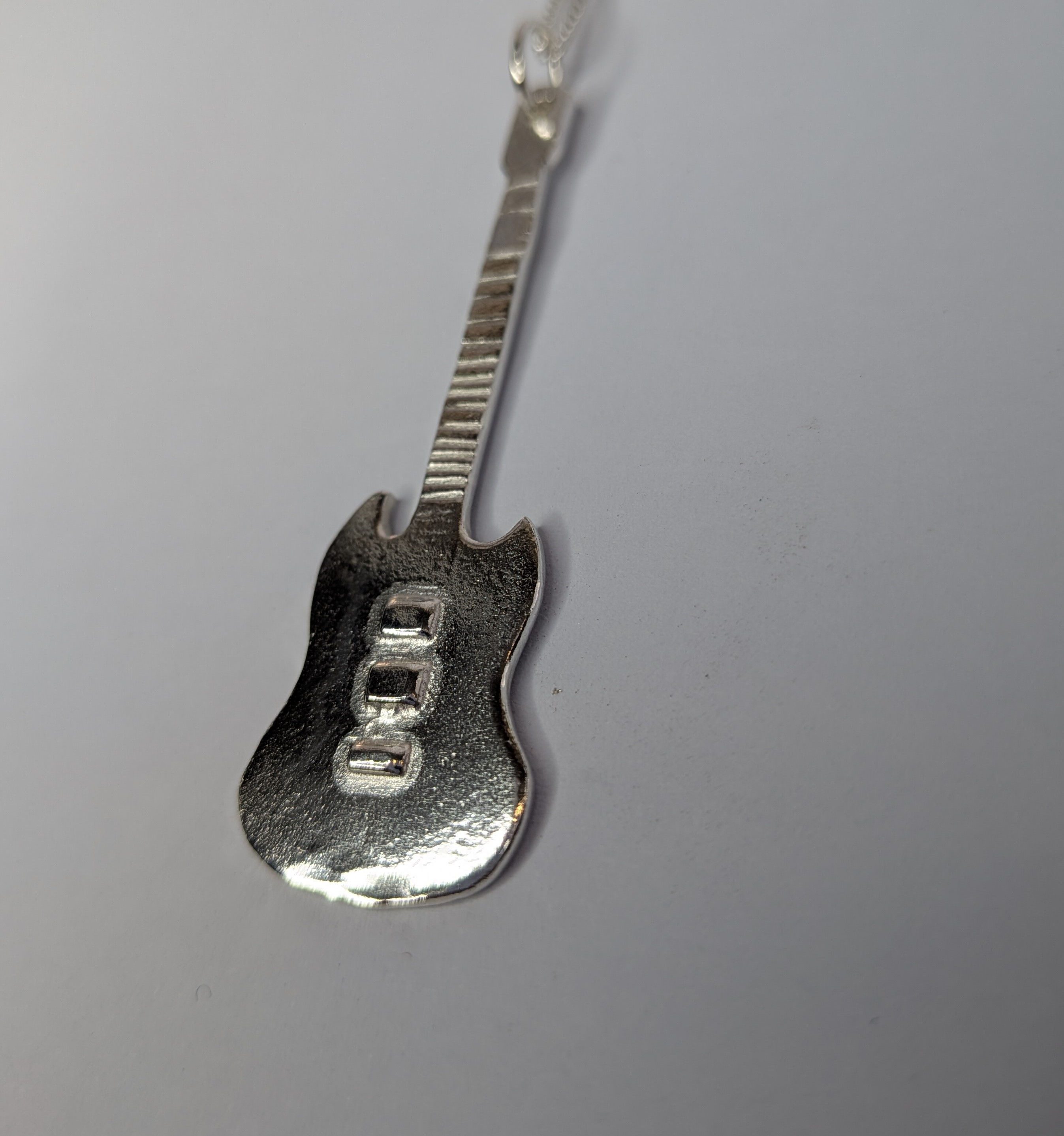 Silver Guitar  pendant. Thunderbird, Flying V or SG.