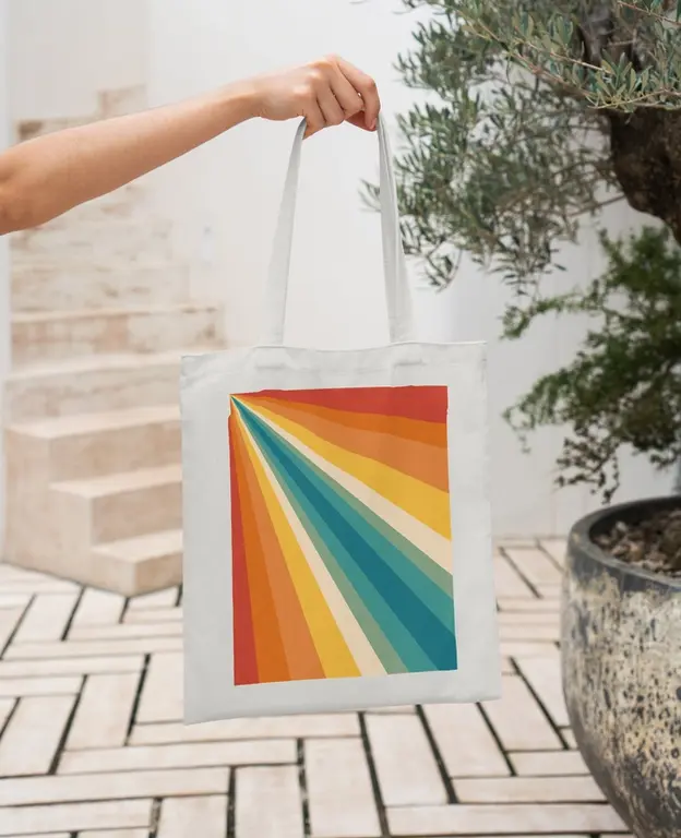 Retro Rainbow Tote Bag featuring bold vintage-style rainbow stripes on an eco-friendly recycled fabric.