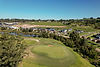 A green at the Drouin Golf & Country Club with homes at The Fairways behind