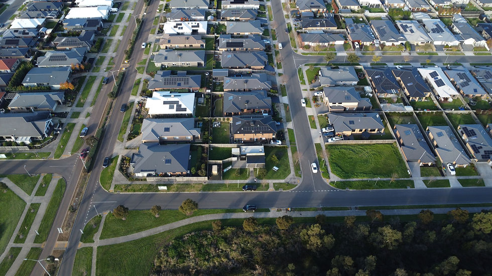 Aerial view of an established residential street at Ferntree Ridge, houses on both sides with cars in the driveways