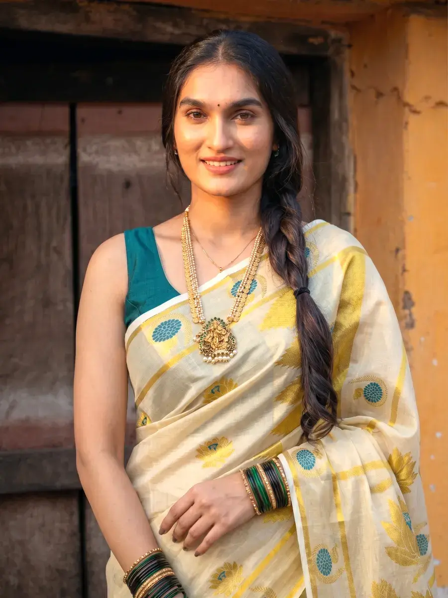 Turquoise Butta Peacock Lotus Zari Woven Kasavu Tissue Premium Saree front closeup view