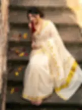 Surajmukhee Embroidery Golden Tissue Saree with Blouse model sitting top view