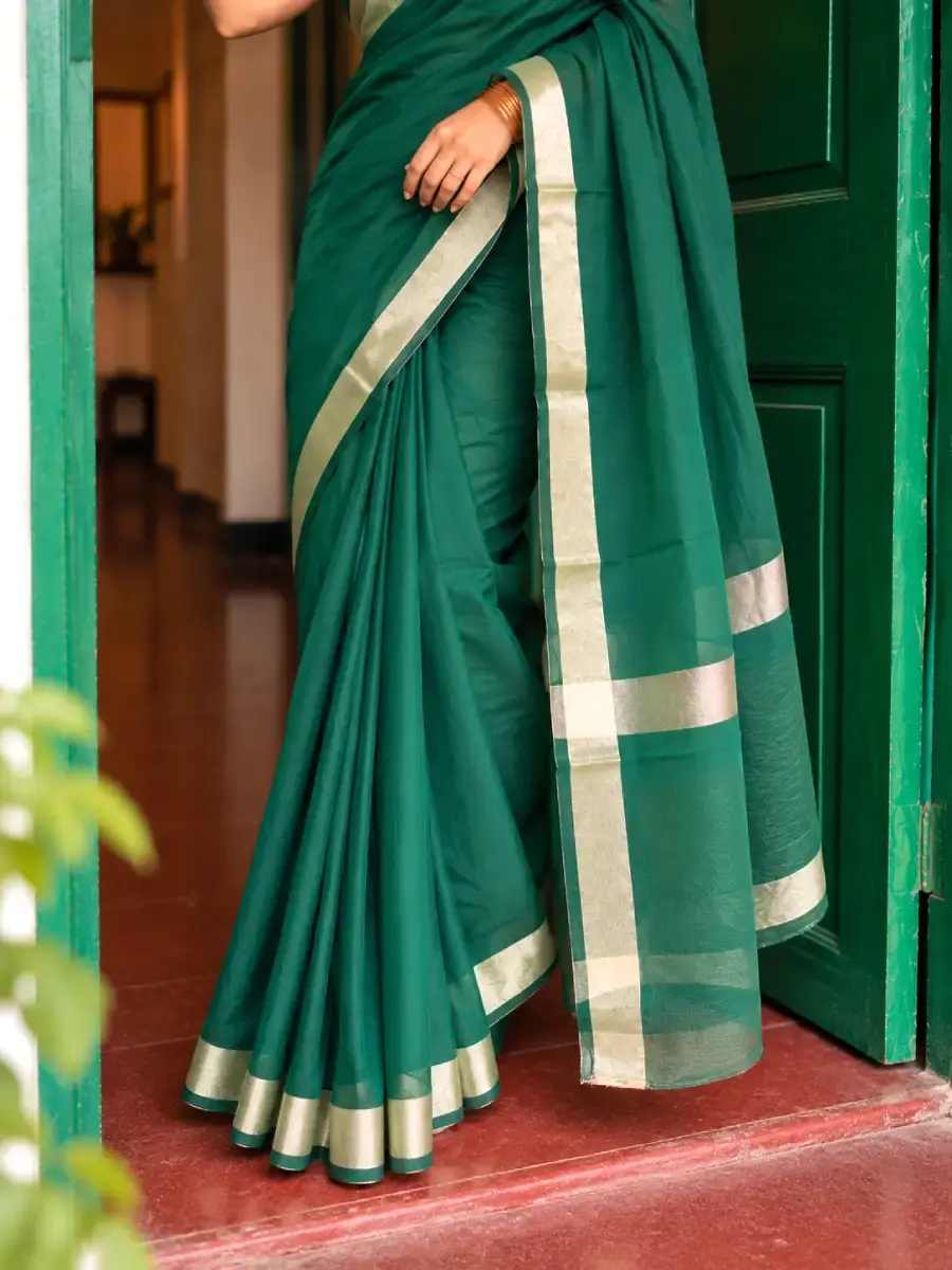 Thumbnail: Bottle Green Plain Cotton Saree with Zari Border bottom portion closeup view
