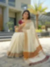 Maroon & Kasavu Stripe Tussel Tissue Saree with Blouse sitting view