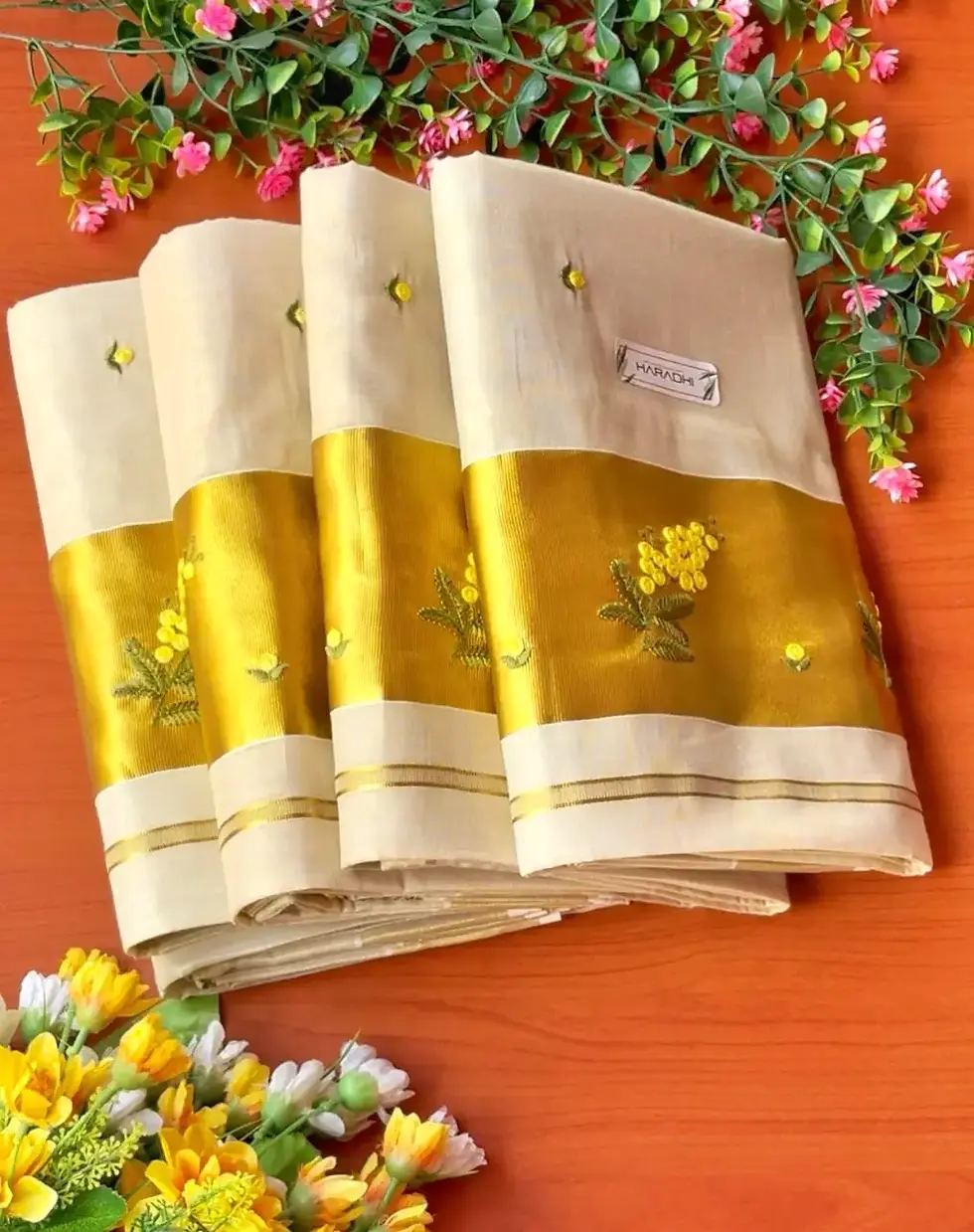 Kanikonna Embroidery Tissue Kerala Saree with Blouse folded view