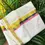 Thumbnail: Golden Kathakali Feather Blue & Pink Kasavu Cotton Double Mundu Dhoti partially opened view