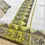Thumbnail: Peacock Temple Designer Coffee Bean  Premium Jacquard Cotton Saree with Blouse bottom angle view