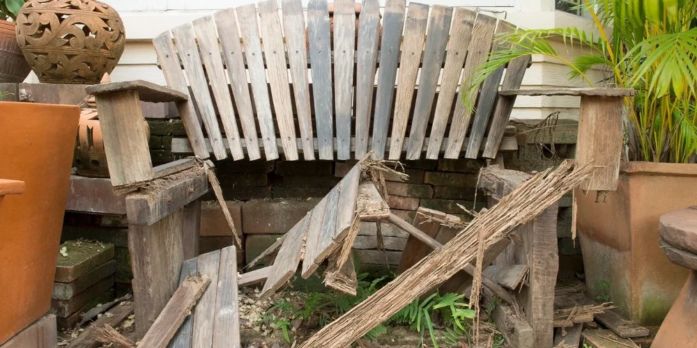 A wooden bench that has been damaged by carpenter ants