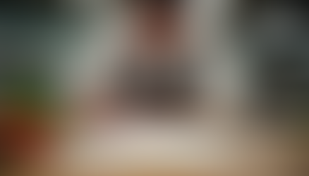 Chef discussing restaurant strategy with a team in a modern kitchen, symbolizing how culinary consultants help improve restaurant operations, profitability, and guest experience.