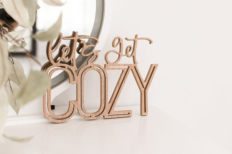 "Let's Get Cozy" tabletop sign. 