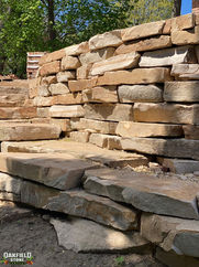 Oakfield Stone's Chestnut Sandstone Outcropping, chestnut stone, natural stone, outcropping stone, gold, tan, buff, yellow, oakfield stone company, fond du lac stone, retaining wall stone, natural retaining wall stone, landscape stone, landscaping stone, supply, quarry, creamy, tan