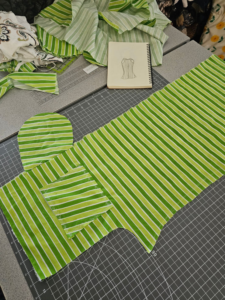 A creative and artistic close-up of folded colorful textiles representing a student's work.