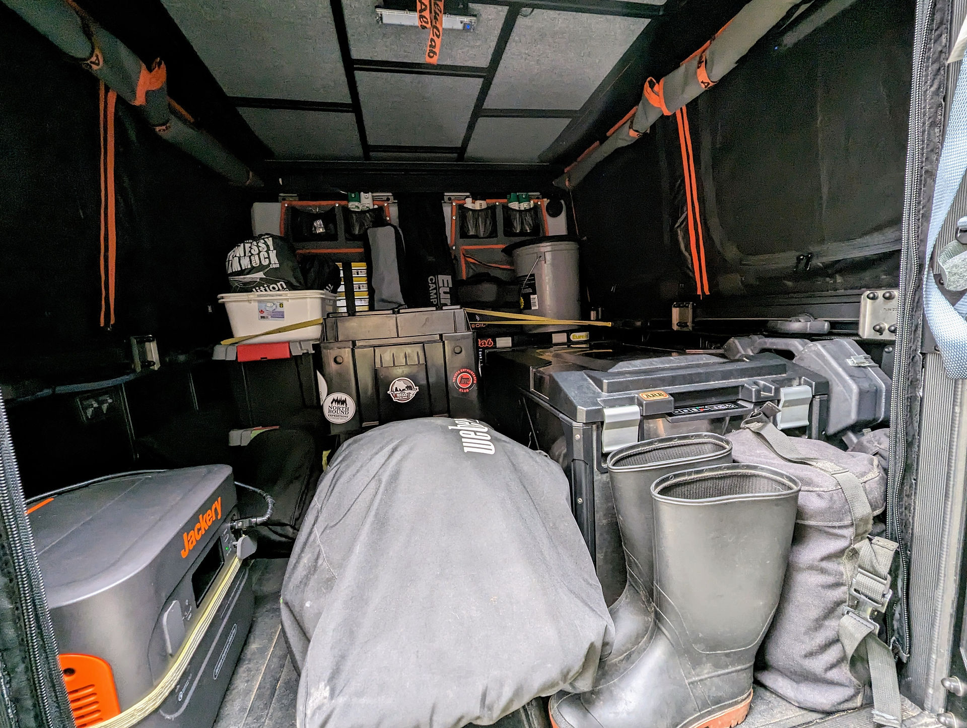 Back of a pick up truck full of camping gear