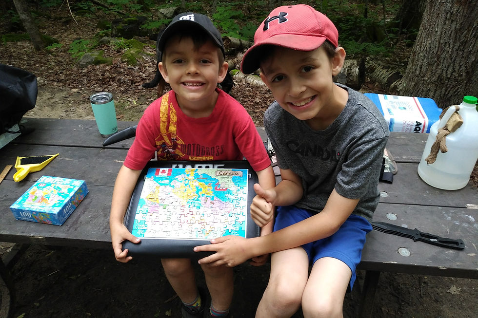Josh and Jacob completing a puzzle.