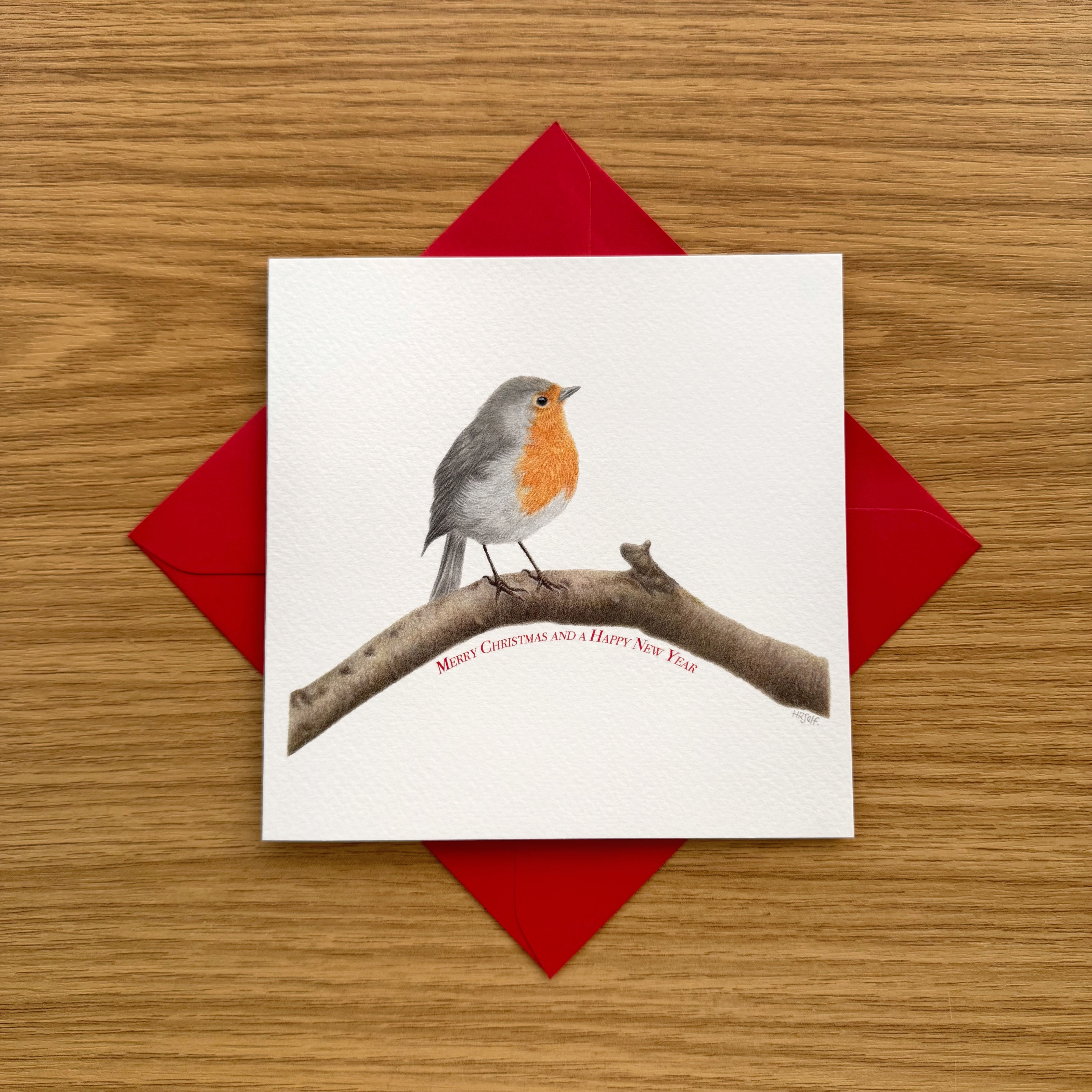 A Robin Christmas greeting card, on a red envelope