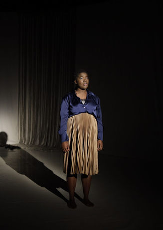 black African woman singer actor theater perform stage song acapella music Berlin Germany 