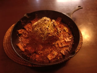 Whole roasted tandoor cauliflower with sesame flatbread