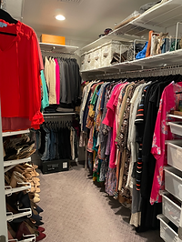 Primary Walk in Closet with women's shoes on shoe racks, drawers, hanging clothes, neatly organized closet, closet organization system, closet organizing
