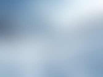 Eye-level view of a snowy mountainside showcasing ski tracks
