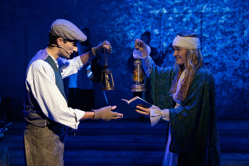 Two actors performing with lanterns