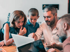 LGBTQIA Fathers teaching their kids about financial literacy.