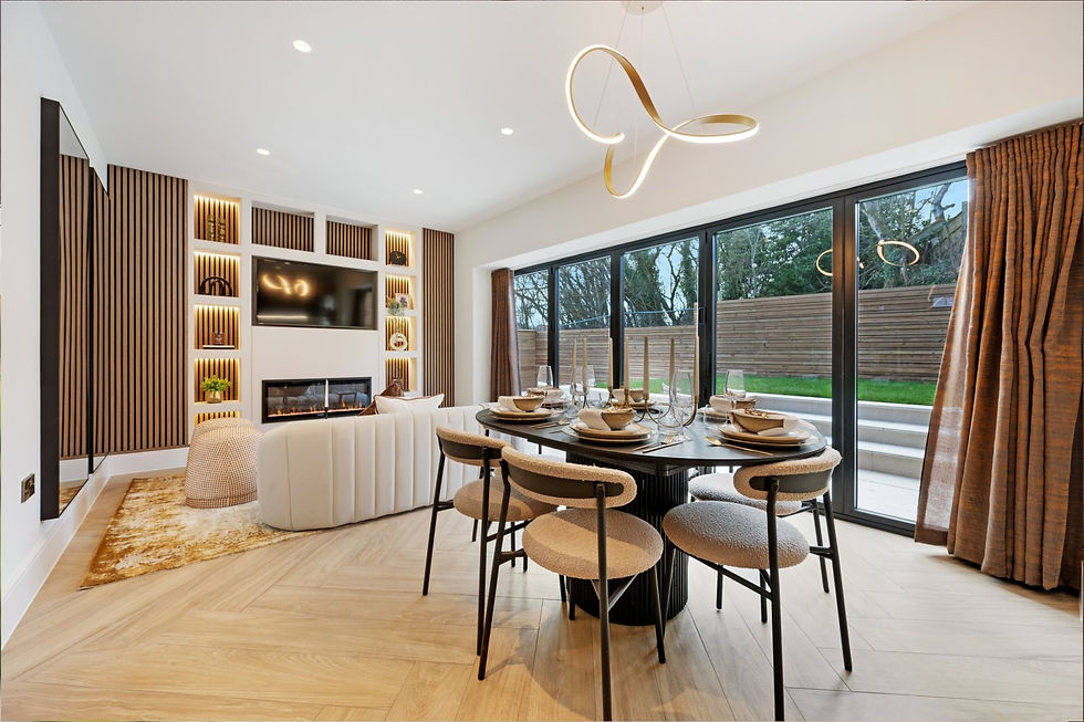 Modern living room with wood accents, round dining table set, large windows, and a contemporary chandelier. Cozy and inviting atmosphere.