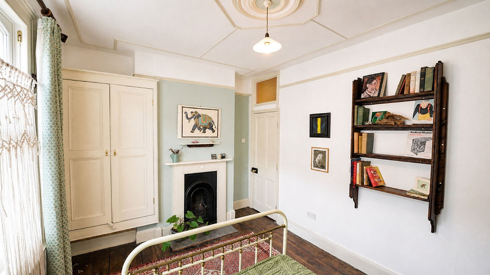 Bright vintage bedroom with brass bed, fireplace, bookshelves, and art; text includes Pablo Picasso and Radical Matter.