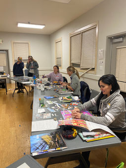 group of women creating vision boards.