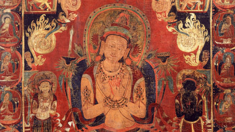 Tibetan thangka of a golden Manjushri displaying dharmachakra mudra and holding two lotuses, supporting emblems of the flaming sword and Prajnaparamita Sutra.